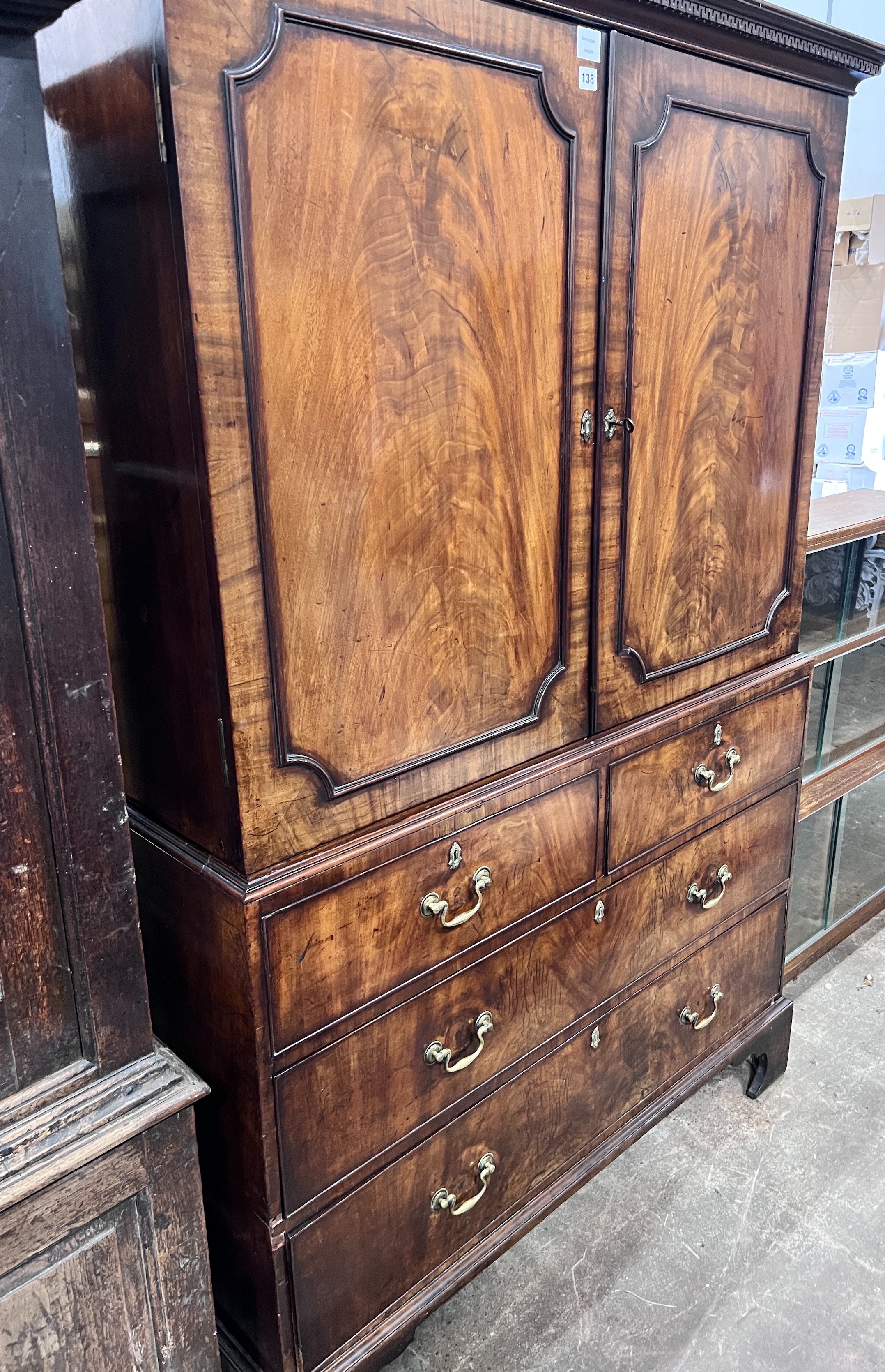A George III mahogany linen press converted to a hanging wardrobe, length 128cm, depth 60cm, height 188cm *Please note the sale commences at 9am.